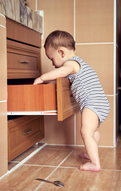 istock Cute baby is learning to walking 812478304