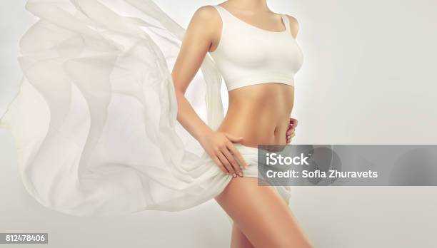 Graceful Female Body Dressed In A White Underwear Suit White Top On The Attractive Well Shaped Woman Breast Stock Photo - Download Image Now