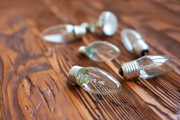istock concept background of bulb on aged wood board 812479198