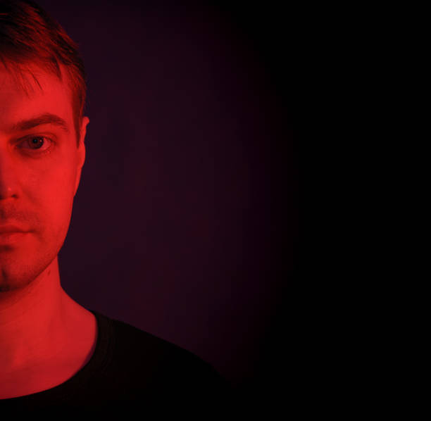 istock Portrait of a man with colored light. 812481526