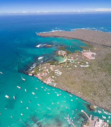 Aerial view of the small town of Puerto Ayora with Las Grietas in back, Santa Cruz Island, Galapagos Islands, Ecuador