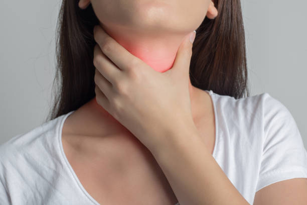 Woman holds her throat Woman holds her throat Hyperthyroidism\ stock pictures, royalty-free photos & images