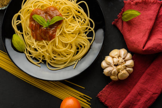 istock spaghetti with tomato sauce and their ingredients around 812494780