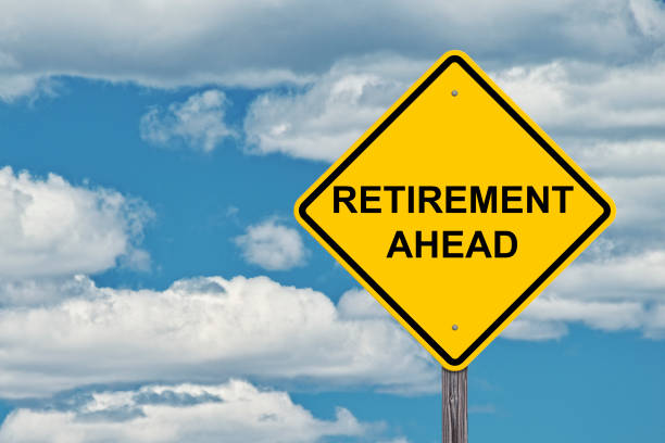 istock Caution Sign Blue Sky Background - Retirement Ahead 812498622