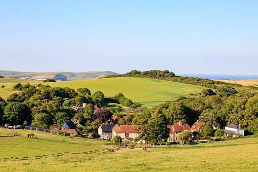 A photograph looking down on Telescombe village in the South Downs, East Sussex