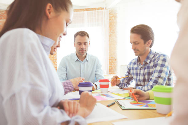 istock Business people discussing financial matter 812513362