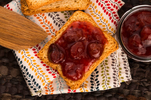 istock Breakfast of cherry jam on toast 812521244
