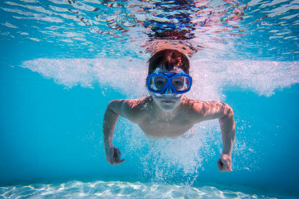 istock Boy swim in swimming pool 812523556
