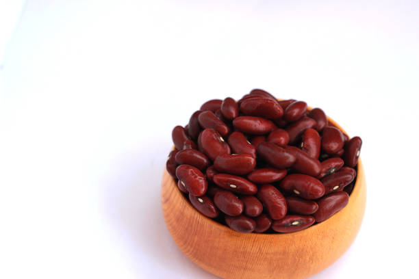istock Red beans arranged beautiful seeds on a white background 812542310
