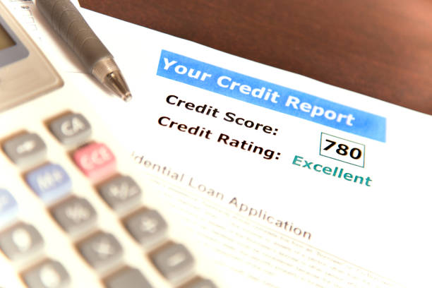 istock Credit report, score, loan documents and calculator on desk. 812557970