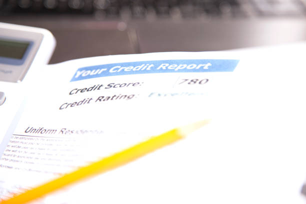 istock Credit report, score, loan documents, laptop and calculator on desk. 812558144