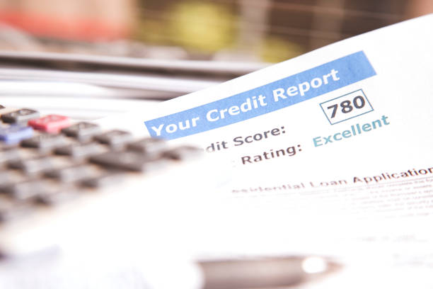 istock Credit report, score, loan documents and calculator on desk. 812558390