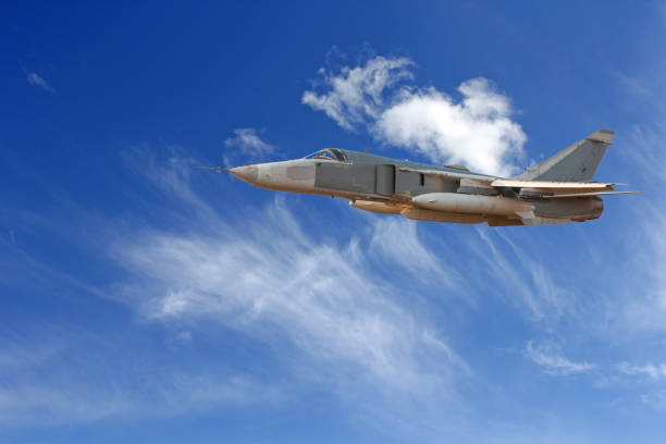 istock Military jet bomber Su-24 Fencer flying above the clouds 812558552