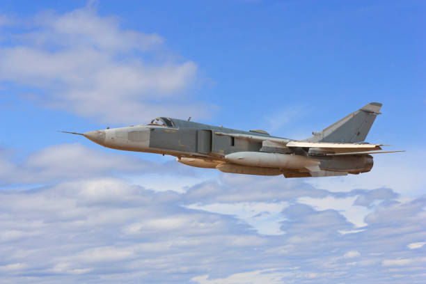 istock Military jet bomber Su-24 Fencer flying above the clouds 812558570