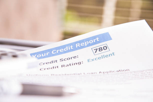 istock Credit report, score, loan documents and calculator on desk. 812563018