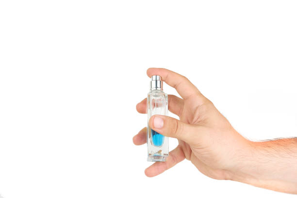 istock Hand Spraying With Bottle Of Perfume 812568240