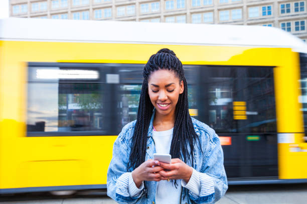 istock Young woman walking in Berlin - Alexanderplatz 812575688