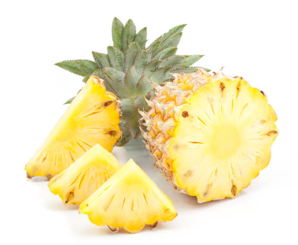 istock pineapple with slices isolated on white 812575756