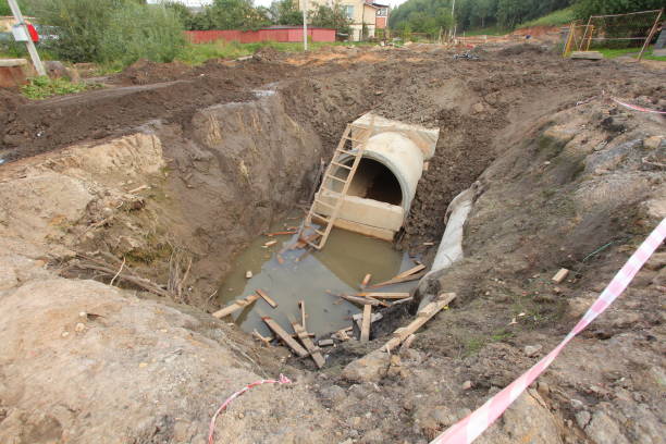 istock sewer pipe in the trench 812576362