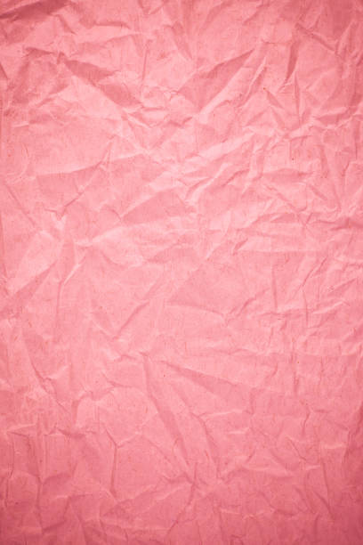 istock Crumpled recycle pink paper background. 812579688