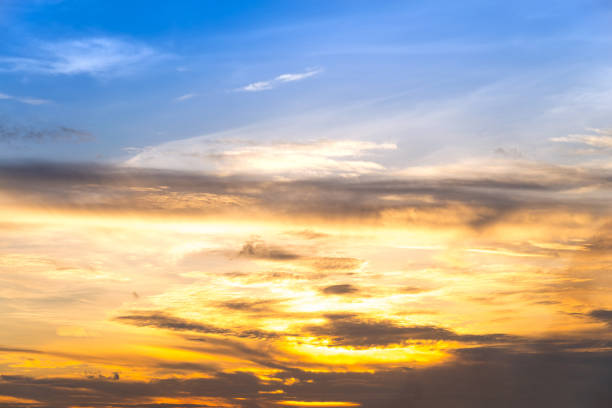 istock sunset sky with rays of light shining clouds and sky background and texture 812579918