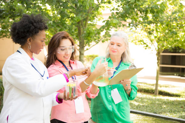 istock STEM themes with female scientists working on water project outdoors. 812582484