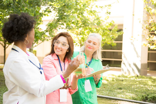 istock STEM themes with female scientists working on water project outdoors. 812584426