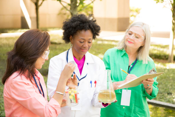 istock STEM themes with female scientists working on water project outdoors. 812584572