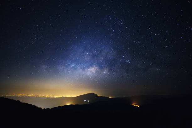 istock Milky Way Galaxy with light city at Doi inthanon 812584606