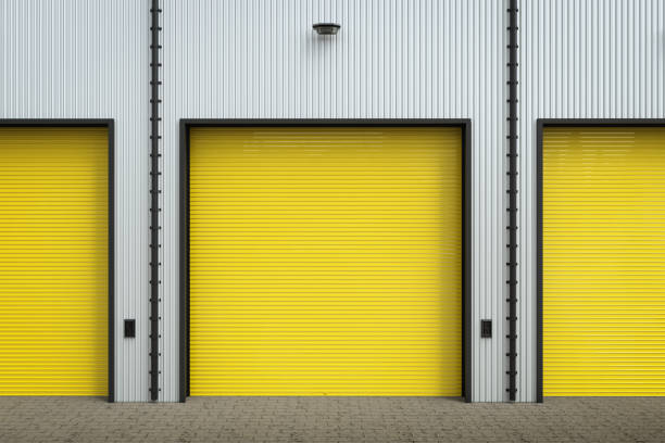 istock warehouse exterior with shutter doors 812584964