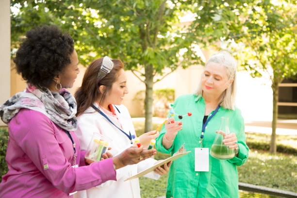 istock STEM themes with female scientists working on water project outdoors. 812585106
