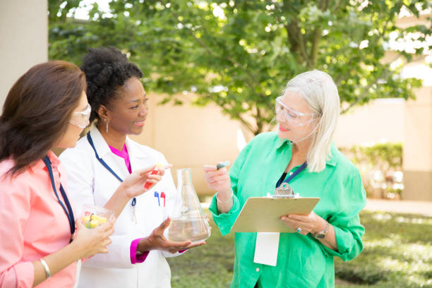 istock STEM themes with female scientists working on water project outdoors. 812585286