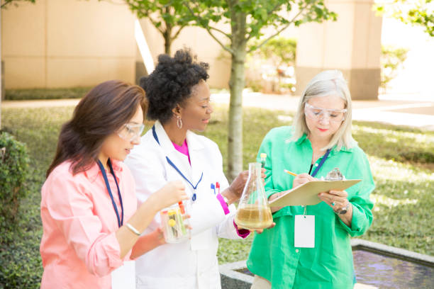 istock STEM themes with female scientists working on water project outdoors. 812587000