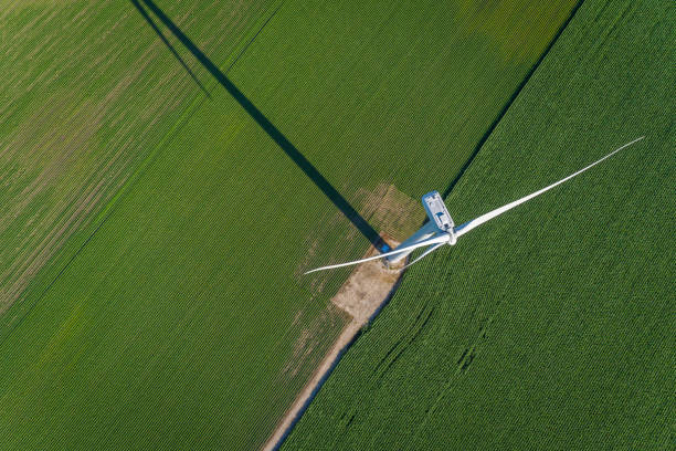 istock Wind turbine and countryside corn field. Top view 812587522