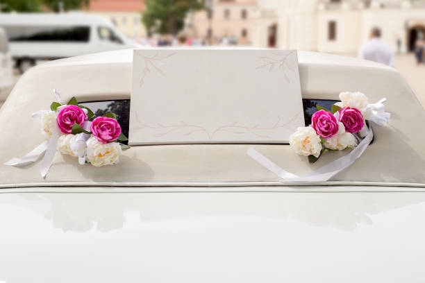 istock White wedding limousine decorated with flowers 812588282