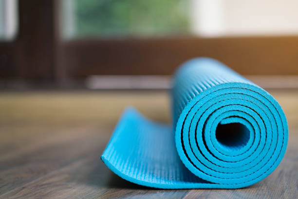 istock yoga mat on wood table 812591006