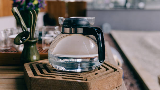 istock Brewing tea in a teapot during a tea ceremony close-up. Brewing tea in the old way with stirring with hot water. Tea tasting during the tea ceremony 812591846