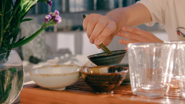 istock Tea ceremony on a shepherd with Buddha figures close-up. Conducting a traditional tea ceremony with Chinese tea 812591902