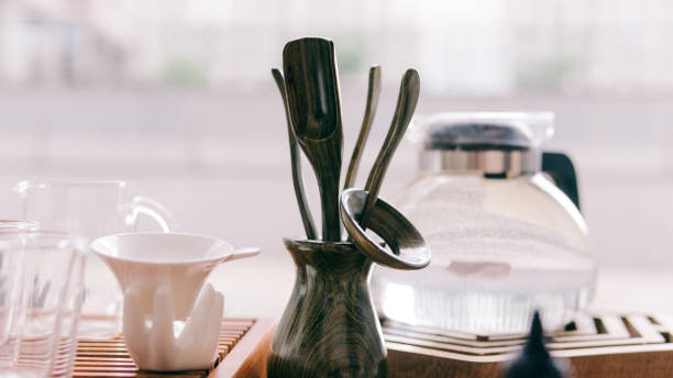 istock Tea ceremony on a shepherd with Buddha figures close-up. Conducting a traditional tea ceremony with Chinese tea 812594432