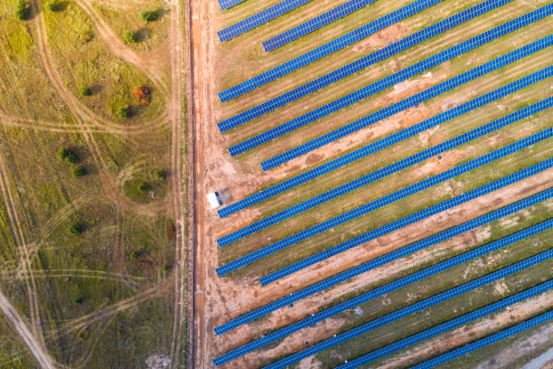 istock Solar panels placed on a countryside meadow. 812601052