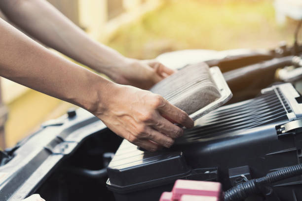 technician holding dirty air filter for car, maintenance and repair concept - air filter car motor vehicle engine imagens e fotografias de stock