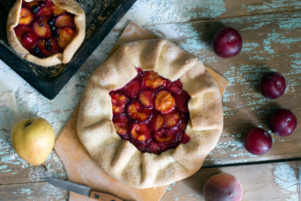 istock Traditional rustic cake prepared from dough and plum 812609458