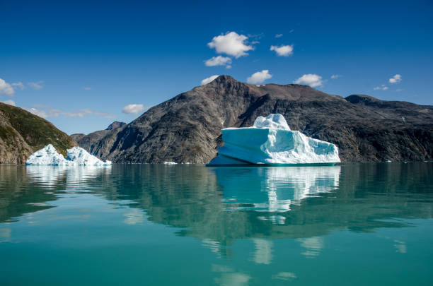 aerial view of icebergs floating in the arctic sea at Ilulissat Icefjord in a cloudy day, Greenland