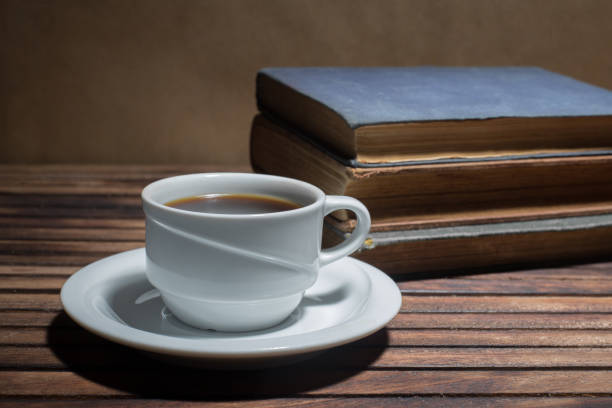 istock Cup of coffee on a wooden table 812631688