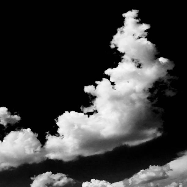 istock Clouds. Black Background. Isolated white clouds on black sky. Set of isolated clouds over black background. Design elements. White isolated clouds. Cutout extracted clouds 812645592