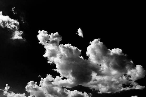istock Clouds. Black Background. Isolated white clouds on black sky. Set of isolated clouds over black background. Design elements. White isolated clouds. Cutout extracted clouds 812650096