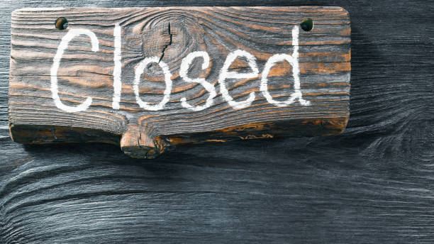 istock Wood signboard on black wood surface 812661844