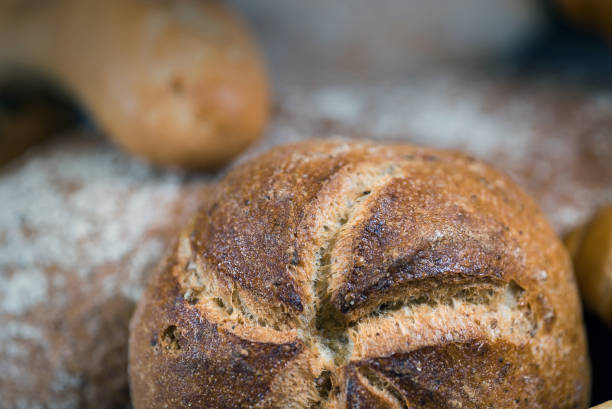 istock Assortment of baked bread on wooden table 812675054
