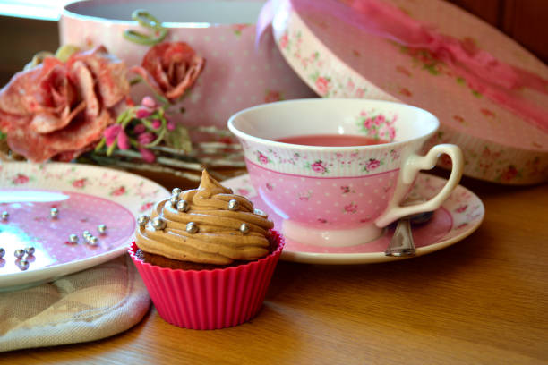 istock Pink chocolate cupcake frosted with chocolate butter-cream 812675088