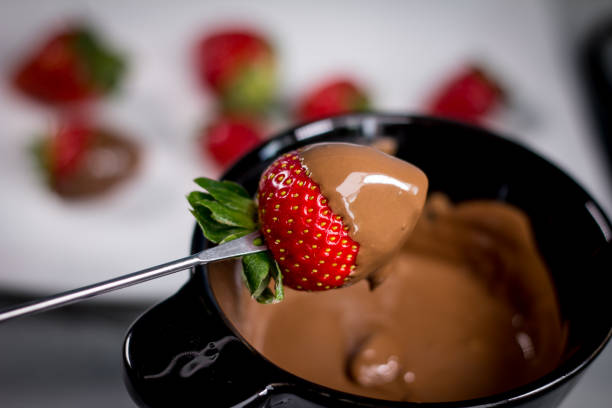 Strawberry with chocolate fondue stock photo